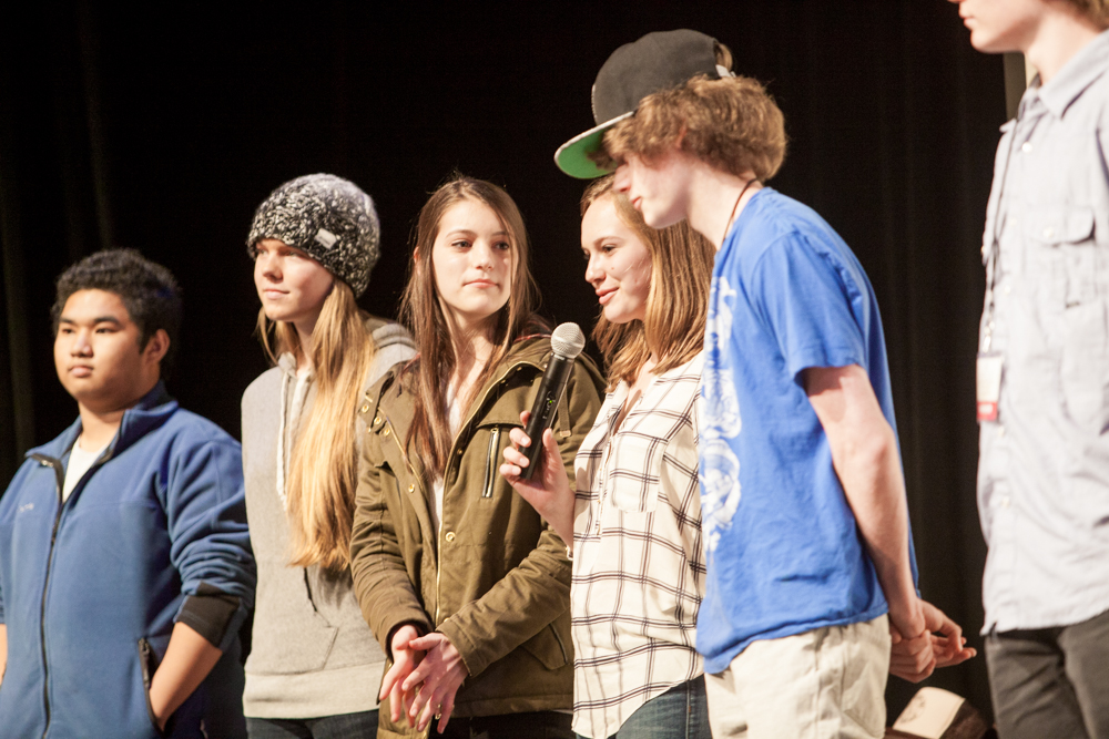 Group of future filmmakers lined up on stage