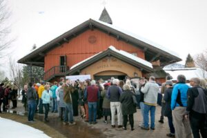 a crowd of people waiting in line outside sun valley opera house