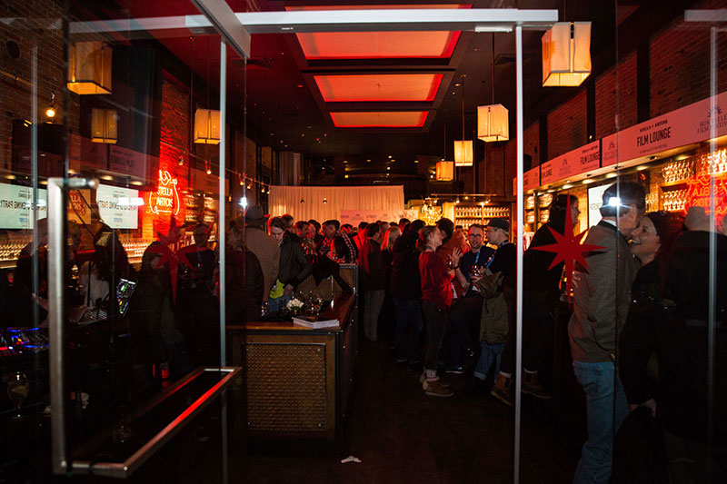 People standing around the bar at Whiskeys, Ketchum